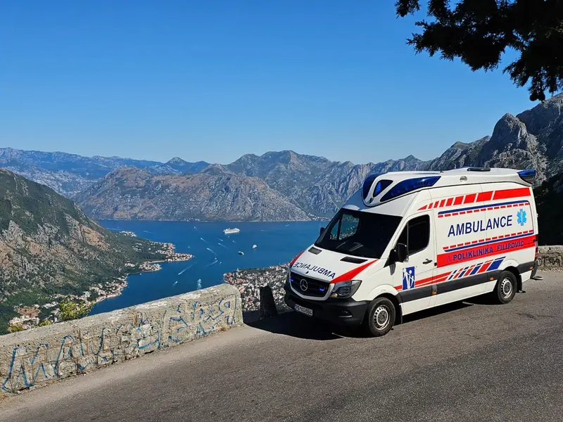 Ambulance on the Kotor serpentine road above the Bay of Kotor, Montenegro
